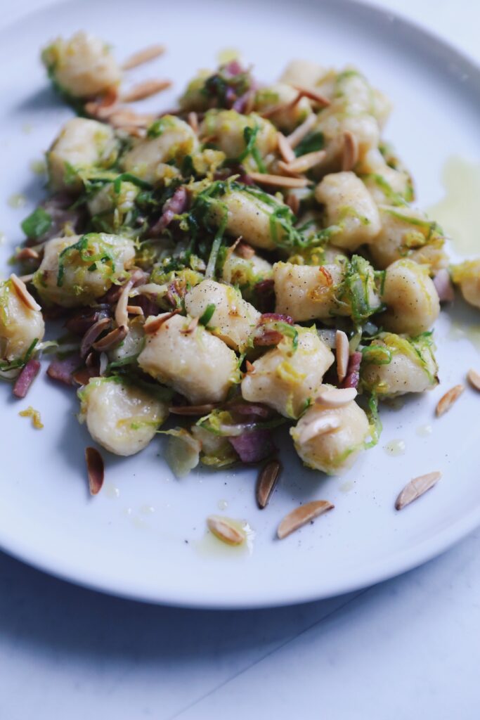 ricotta gnocchi with brussels sprouts, garlic, bacon & almonds